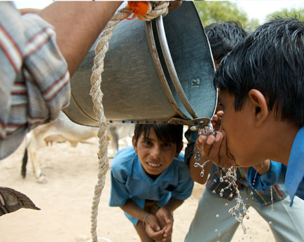 Afterschool Boys Drink from Well